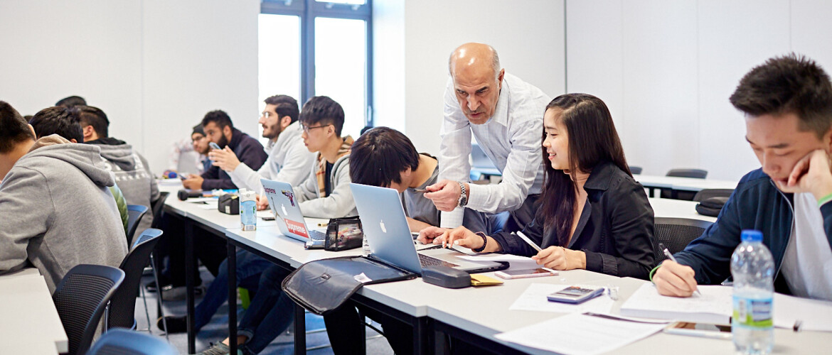 Lecturer helping students